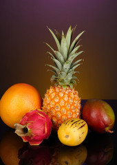 Composition of exotic fruits on colorful background