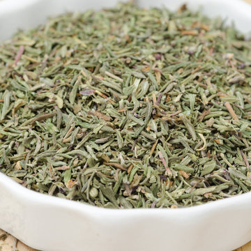 dried thyme in a white bowl