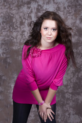 Naklejka premium Girl with long hair in a pink blouse