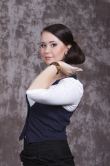 Obraz premium Girl with long hair in a white shirt and a blue vest