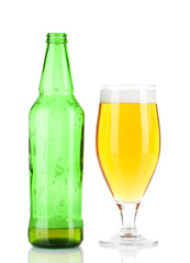 Glass of beer with bottle isolated on white