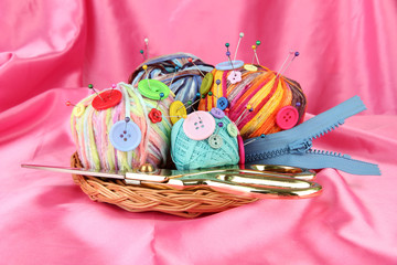 Colorful buttons and multicolor wool balls,