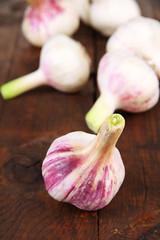 Fresh garlic, on wooden background