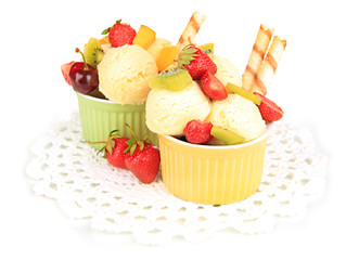 Delicious  ice cream with fruits and berries in bowl isolated