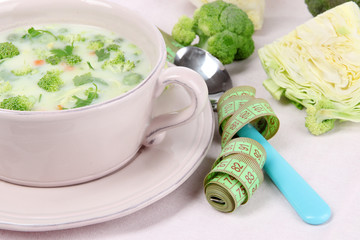 Cabbage soup in plate on napkin close-up
