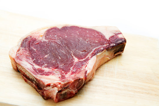 Raw dry aged t-bone steak