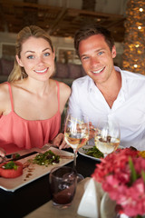 Couple Enjoying Meal In Restaurant