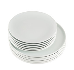 Pile of clean white dish plates isolated
