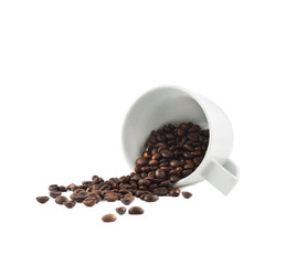 Spilled coffee beans from the cup isolated
