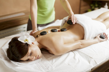Obraz na płótnie Canvas Hot stone massage therapy
