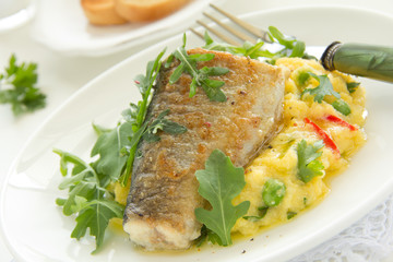 Grilled trout with couscous and vegetables.