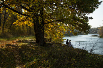 two people on the river bank