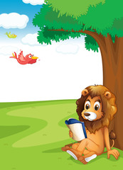 Obraz na płótnie Canvas A lion reading under the tree