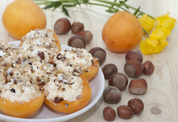 Apricots stuffed with cottage cheese and nuts.