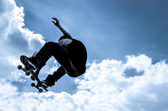 blue toned moonlight skateboarding abstract
