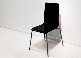black chair over wall