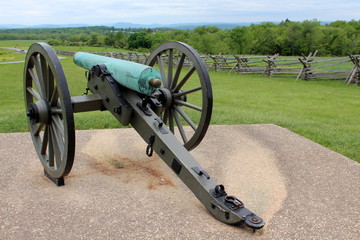 Old Civil War canon displayed on concrete slab