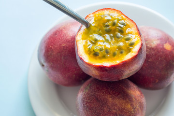 Passion fruit with a spoon