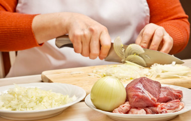 Obraz na płótnie Canvas Stuffing preparation, onions cutting