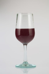 Red Wine in glass on white
