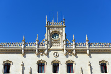Fototapeta na wymiar Rossio Train Station Clock tower in old town Lisbon, Portugal