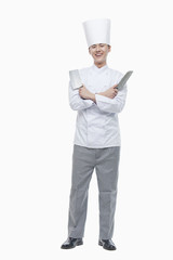 Full Length Portrait of Chef with Kitchen Knives