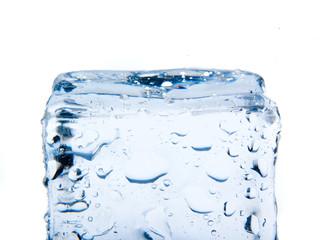 Ice cube with water drops isolated on white