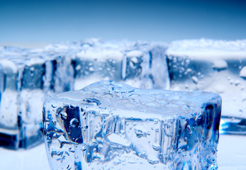 Naklejka na ściany i meble Abstract photo of ice cubes with blue lighting