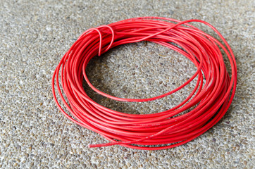 Red hot power cable on sand floor