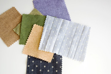pieces of color fabric on white