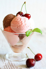 Cherry ice cream on white planks in restaurant