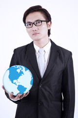 Businessman hold globe on white background
