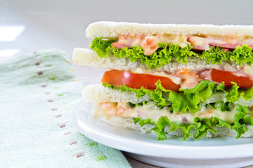 A ham salad sandwich on oat bread
