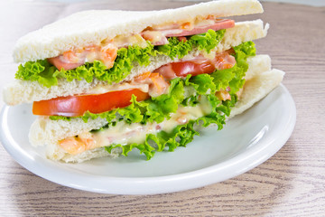 A ham salad sandwich on oat bread