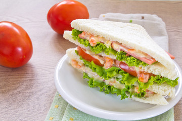 A ham salad sandwich on oat bread