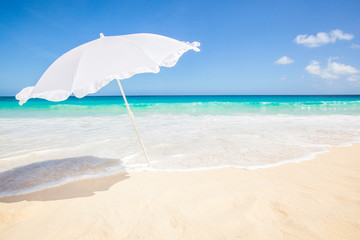 white sunshade at the beach