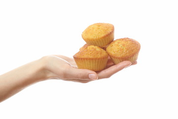 Hand holding cakes, isolated on white background