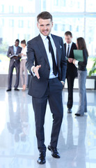 A business man with an open hand ready to seal a deal