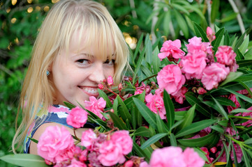 Woman in garden with roses