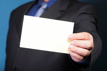 Close up of business note card in male hand