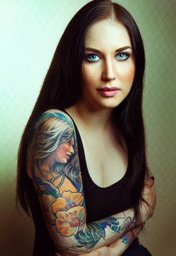Beautiful glamorous girl with tattoos.