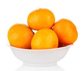 Tasty mandarines in color bowl isolated on white