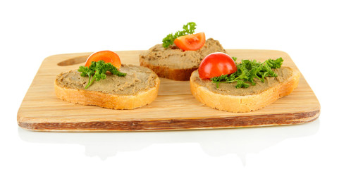 Fresh pate on bread on wooden board, isolated on white