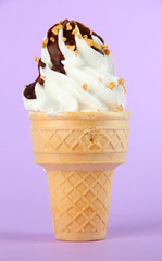 Tasty ice cream with chocolate, on purple background