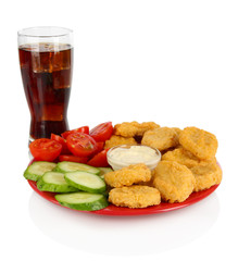 Fried chicken nuggets with vegetables,cola and sauce isolated