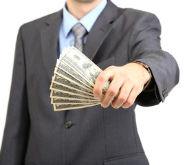 Young businessman with money isolated on white.