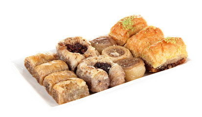 Sweet baklava on plate isolated on white