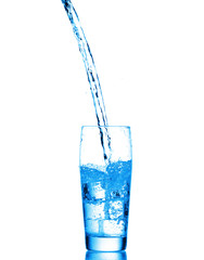 Water splashes in the glass on white background
