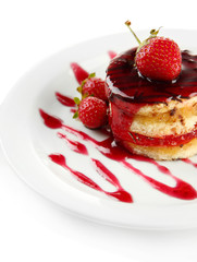 Tasty biscuit cake with jam and berries