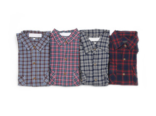 Four close up on mens plaid shirts